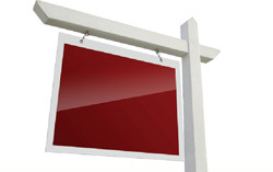 A premium real estate lawn sign with a laminated red panel hanging from a white post